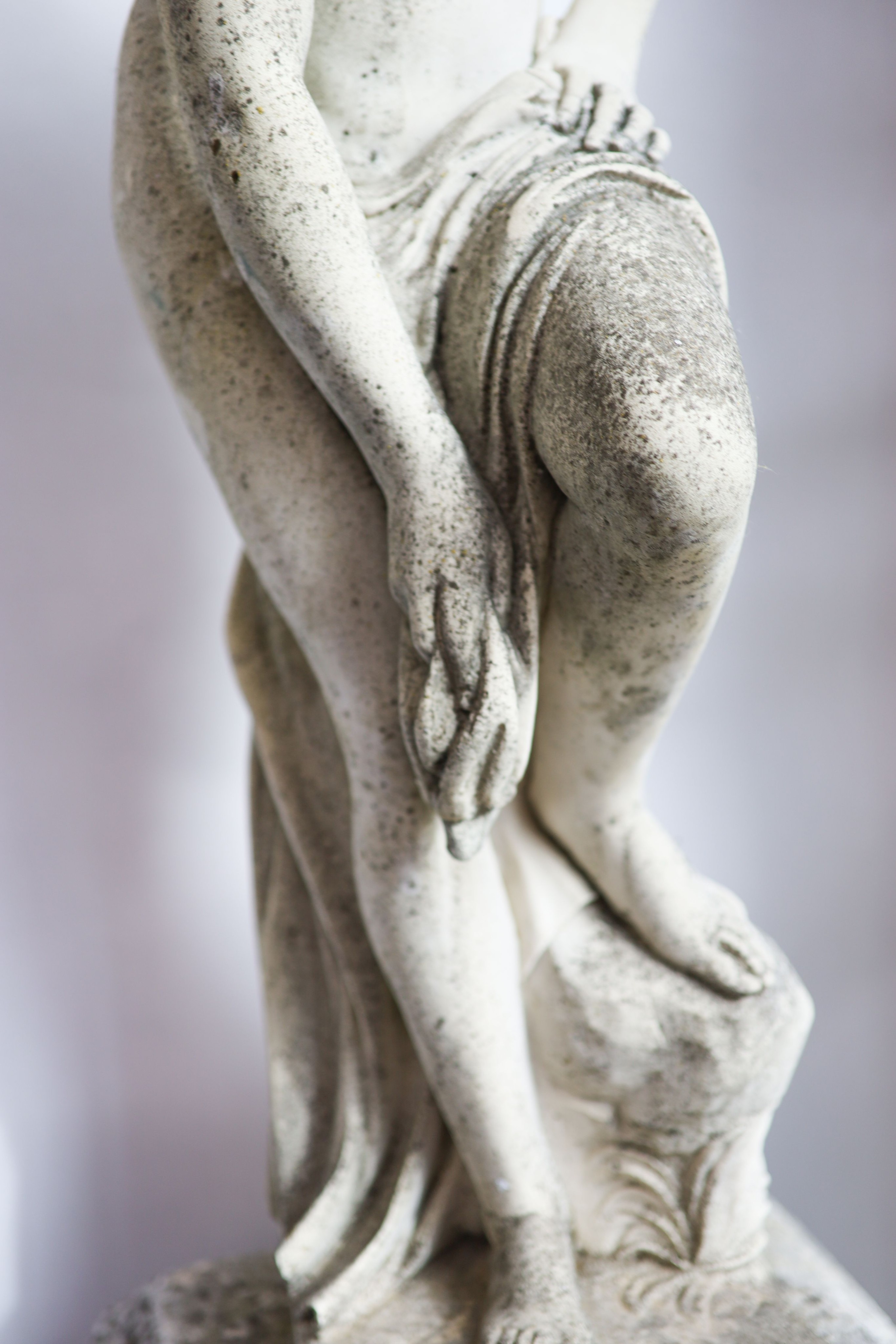 A 19th century carved marble statue of Venus, raised on a reconstituted plinth, height 135cm